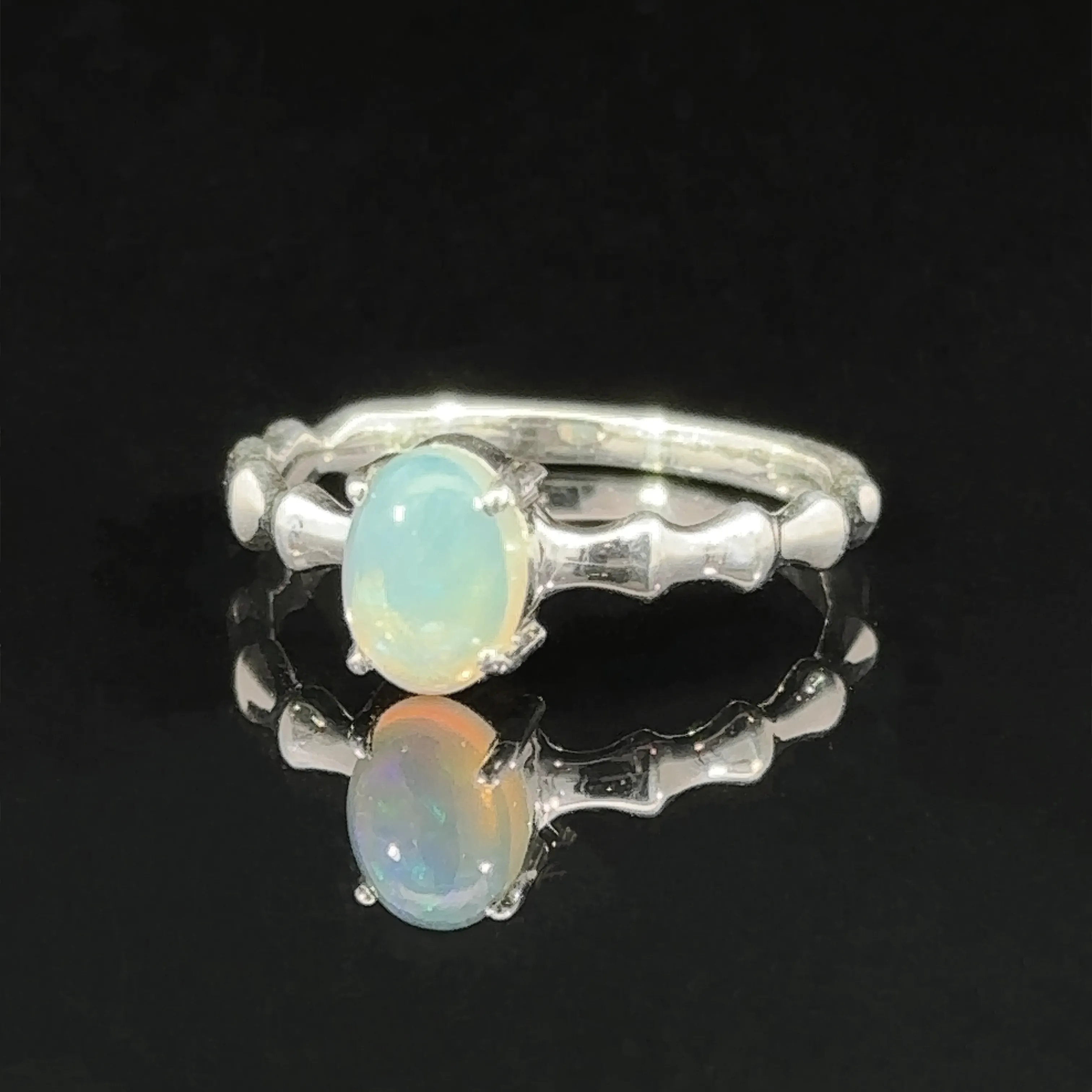 Pronged Oval Gemstone Ring with Textured Band